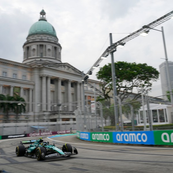 Aston Martin driver Fernando Alonso of Spain steers his car during the third practice session of the Singapore Formula One Grand Prix at the Marina Bay Street Circuit, in Singapore, Saturday, Sept. 21, 2024. (AP Photo/Vincent Thian)