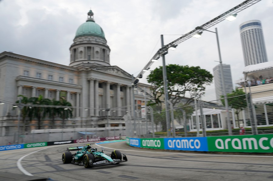 Aston Martin driver Fernando Alonso of Spain steers his car during the third practice session of the Singapore Formula One Grand Prix at the Marina Bay Street Circuit, in Singapore, Saturday, Sept. 21, 2024. (AP Photo/Vincent Thian)