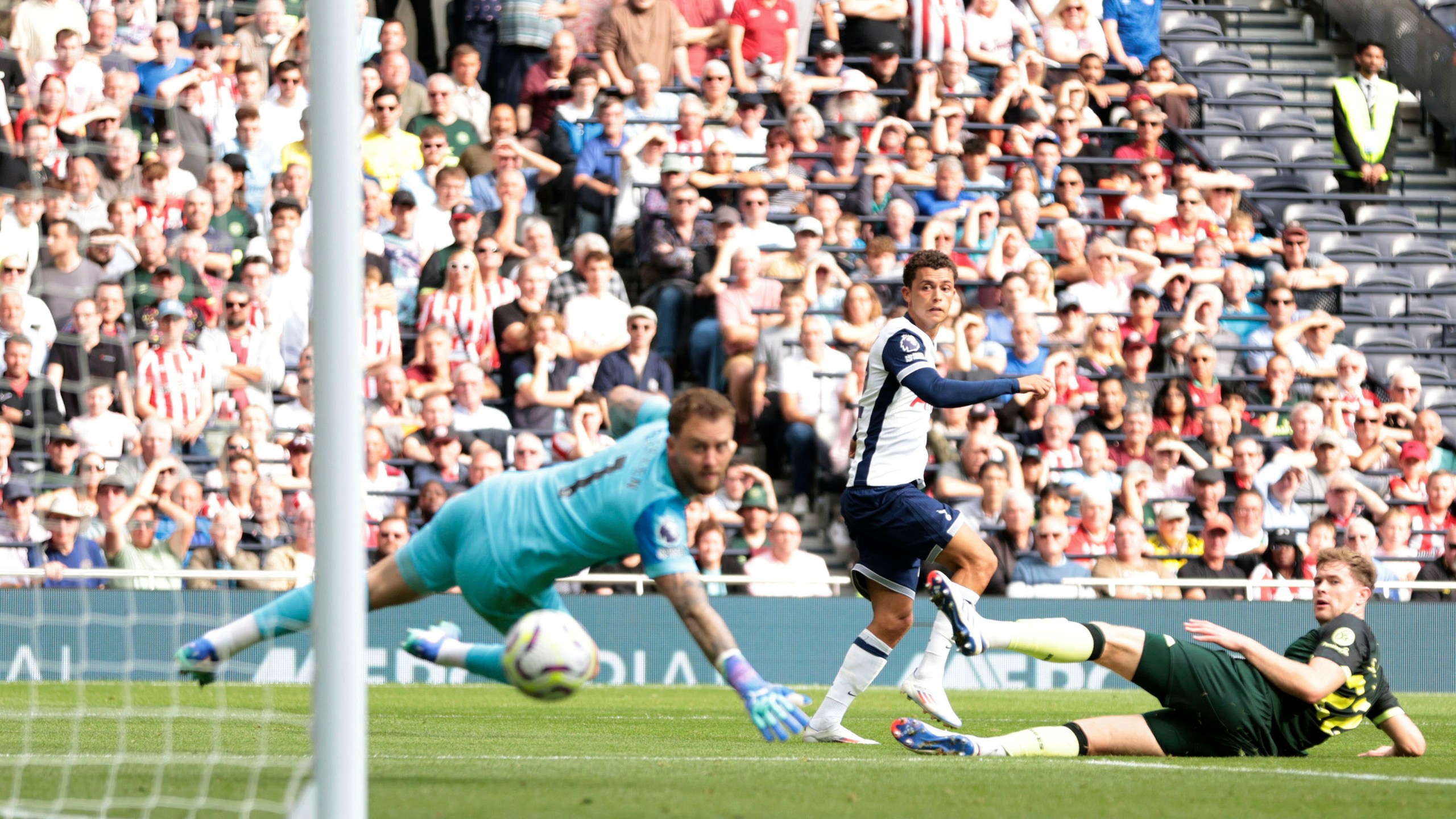 Tottenham Hotspur's Brennan Johnson, center scores his side's second goal of the game, during the English Premier League soccer match between Tottenham Hotspur and Brentford, at the Tottenham Hotspur Stadium, in London, Saturday, Sept. 21, 2024. (Steven Paston/PA via AP)