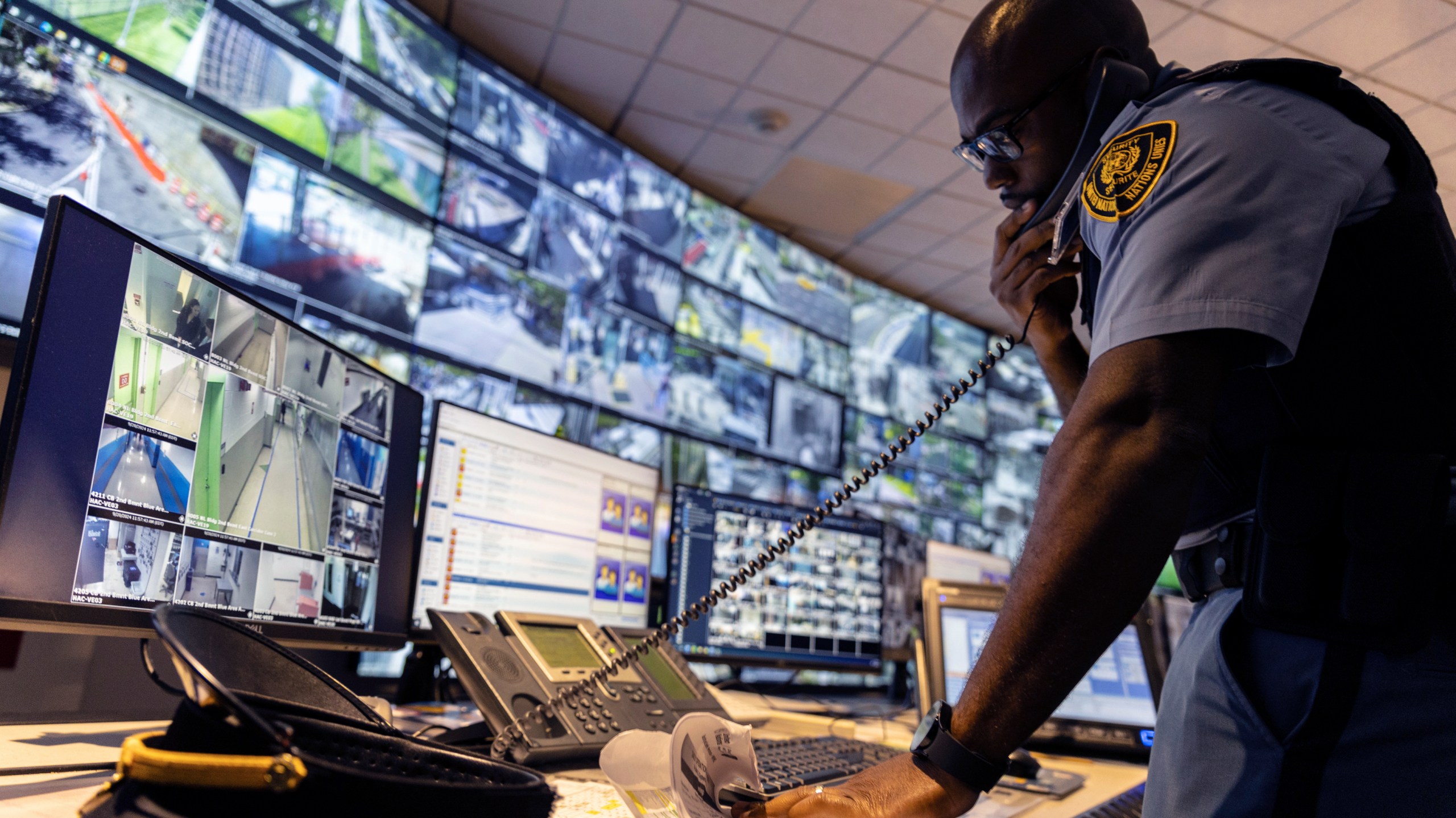 A security officer speaks on the phone inside the UN Security Operations Center inside the United Nations Headquarters, Friday Sept. 20, 2024. (AP Photo/Stefan Jeremiah)