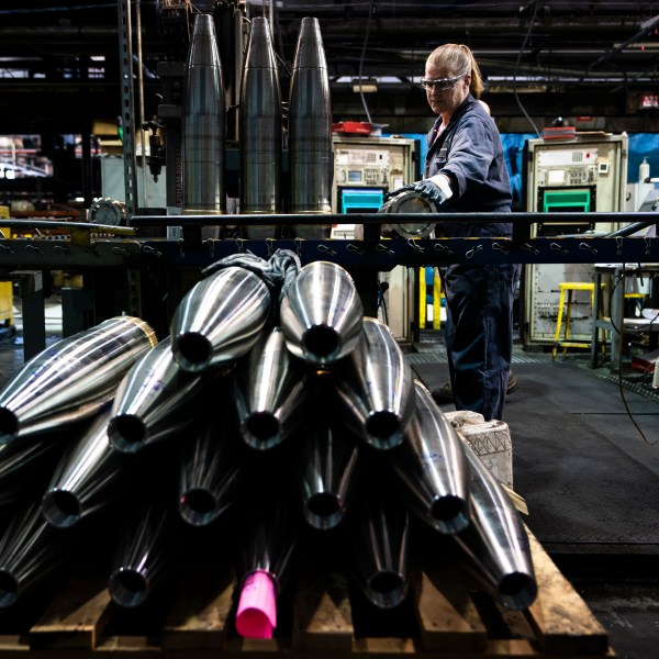 FILE -A steel worker moves a 155 mm M795 artillery projectile during the manufacturing process at the Scranton Army Ammunition Plant in Scranton, Pa., Thursday, April 13, 2023. (AP Photo/Matt Rourke, File)