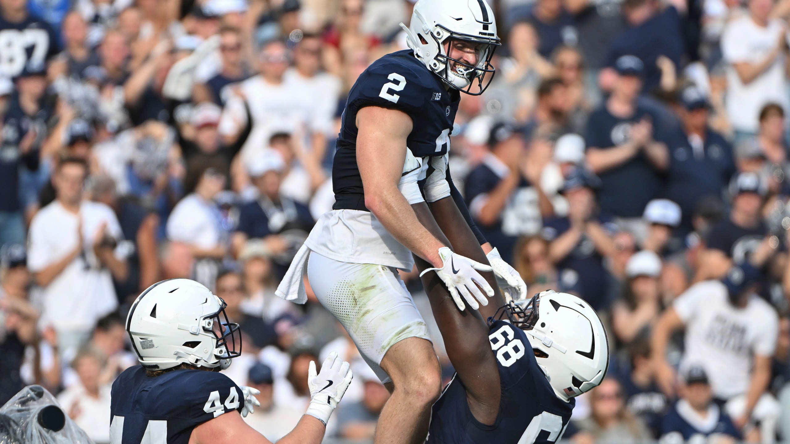 Penn State wide receiver Liam Clifford (2) celebrates after a touchdown pass with offensive lineman Anthony Donkoh (68) during the second quarter of an NCAA college football game against Kent State, Saturday, Sept. 21, 2024, in State College, Pa. (AP Photo/Barry Reeger)