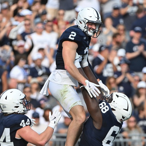 Penn State wide receiver Liam Clifford (2) celebrates after a touchdown pass with offensive lineman Anthony Donkoh (68) during the second quarter of an NCAA college football game against Kent State, Saturday, Sept. 21, 2024, in State College, Pa. (AP Photo/Barry Reeger)