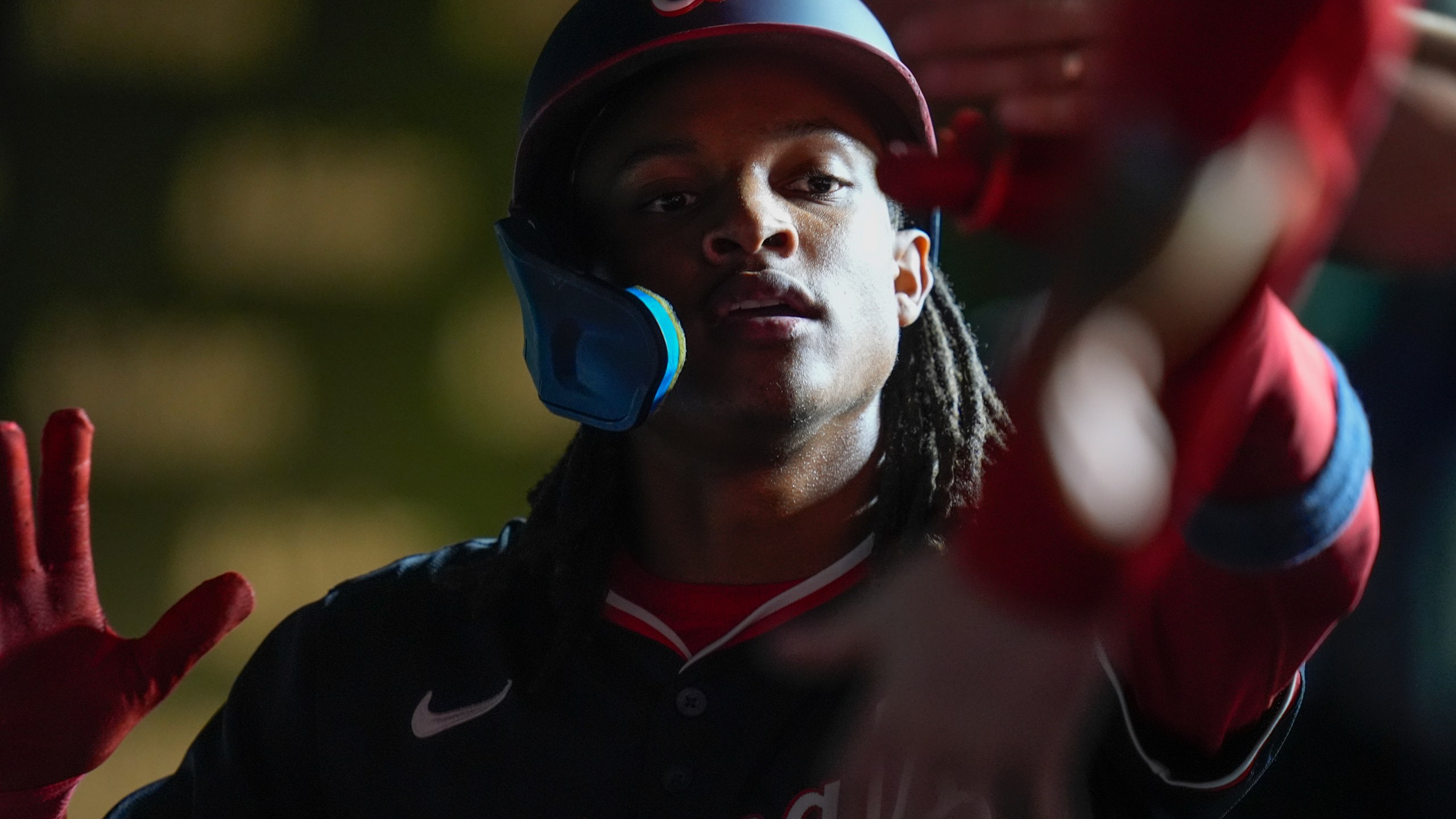 Washington Nationals' CJ Abrams celebrates after scoring on a double from James Wood during the third inning of a baseball game against the Chicago Cubs, Thursday, Sept. 19, 2024, in Chicago. (AP Photo/Erin Hooley)