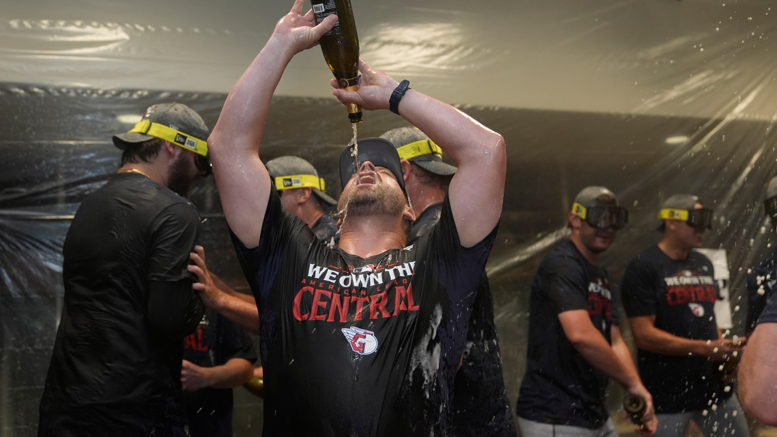 Cleveland Guardians manager Stephen Vogt celebrates in the clubhouse following a baseball game against the St. Louis Cardinals and winning the American League Central Saturday, Sept. 21, 2024, in St. Louis. (AP Photo/Jeff Roberson)