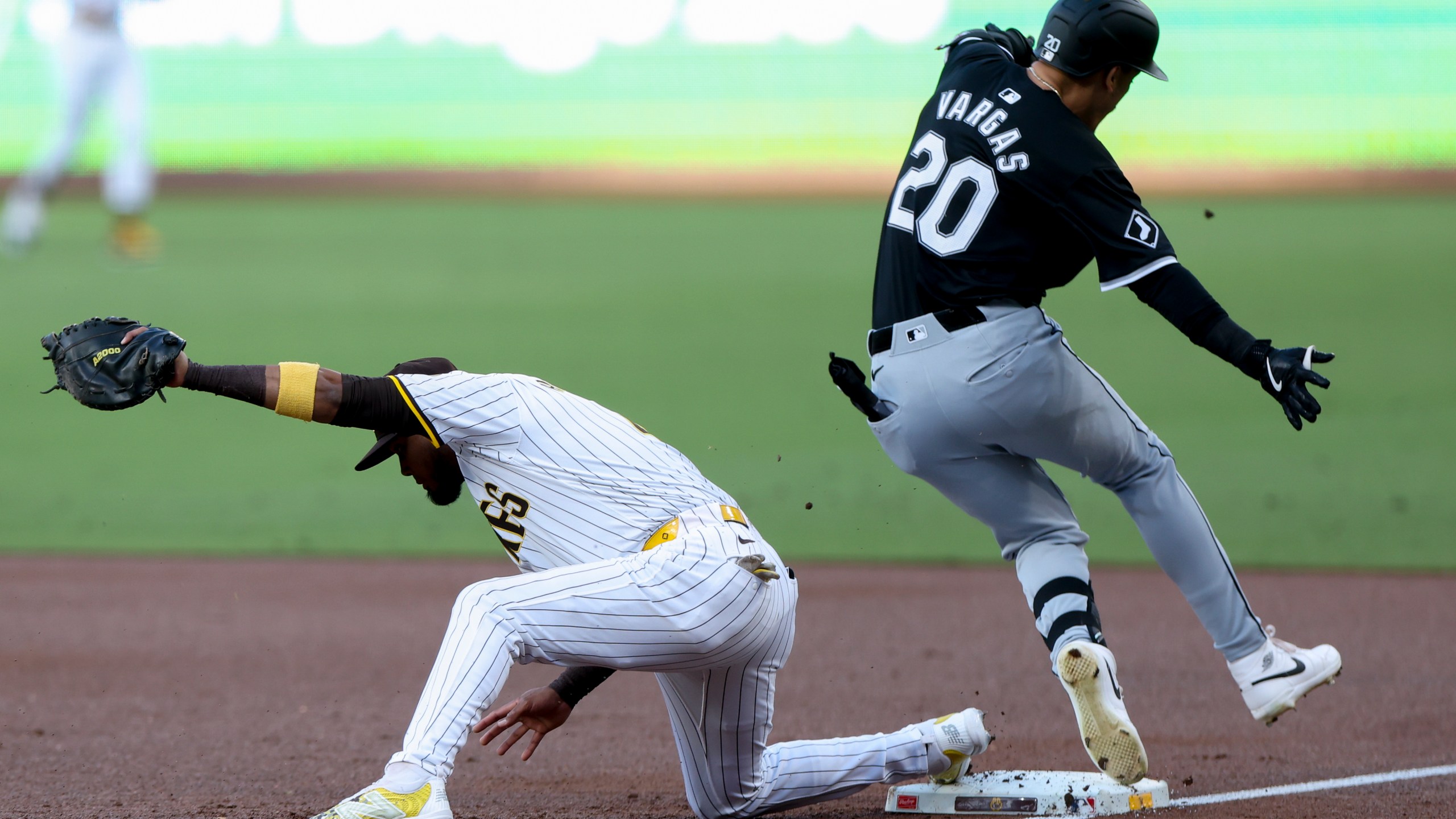 San Diego Padres first baseman Luis Arraez, left, forces out Chicago White Sox's Miguel Vargas during the first inning of a baseball game, Saturday, Sept. 21, 2024, in San Diego. (AP Photo/Ryan Sun)