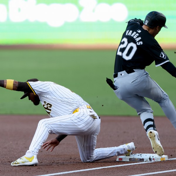 San Diego Padres first baseman Luis Arraez, left, forces out Chicago White Sox's Miguel Vargas during the first inning of a baseball game, Saturday, Sept. 21, 2024, in San Diego. (AP Photo/Ryan Sun)