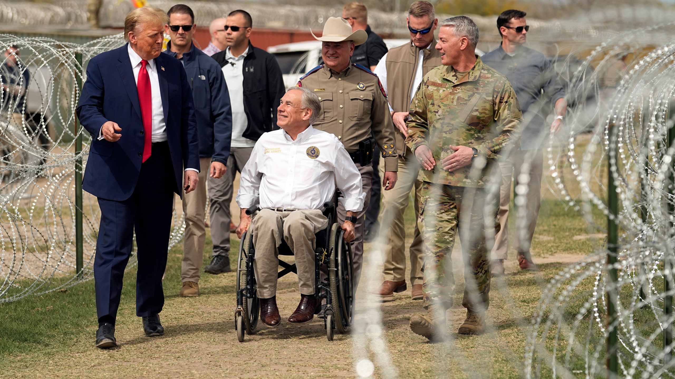 FILE - Republican presidential candidate former President Donald Trump talks with Texas Gov. Greg Abbott during a visit to the U.S.-Mexico border, on Feb. 29, 2024, in Eagle Pass, Texas. (AP Photo/Eric Gay)