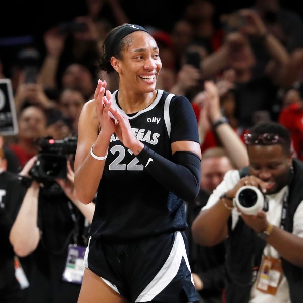 Las Vegas Aces center A'ja Wilson (22) celebrates during the second half of a WNBA basketball game against the Connecticut Sun, Sunday, Sept. 15, 2024, in Las Vegas. (Steve Marcus/Las Vegas Sun via AP)