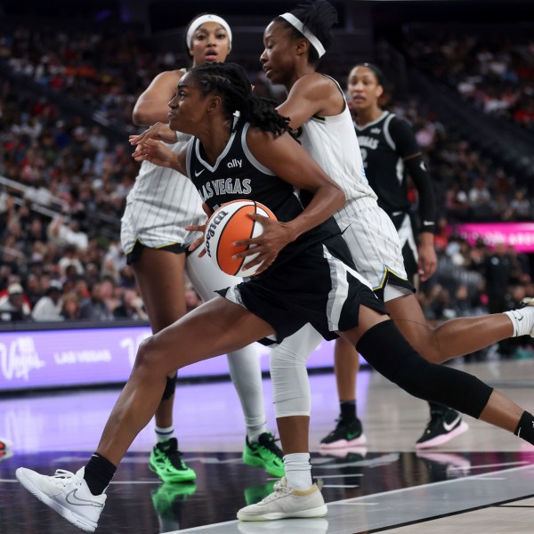 Las Vegas Aces guard Tiffany Hayes drives toward the hoop against Chicago Sky forward Angel Reese, back left, and guard Lindsay Allen, right, during the second half of an WNBA basketball game, Tuesday, Sept. 3, 2024, in Las Vegas. L (Ellen Schmidt/Las Vegas Sun via AP)