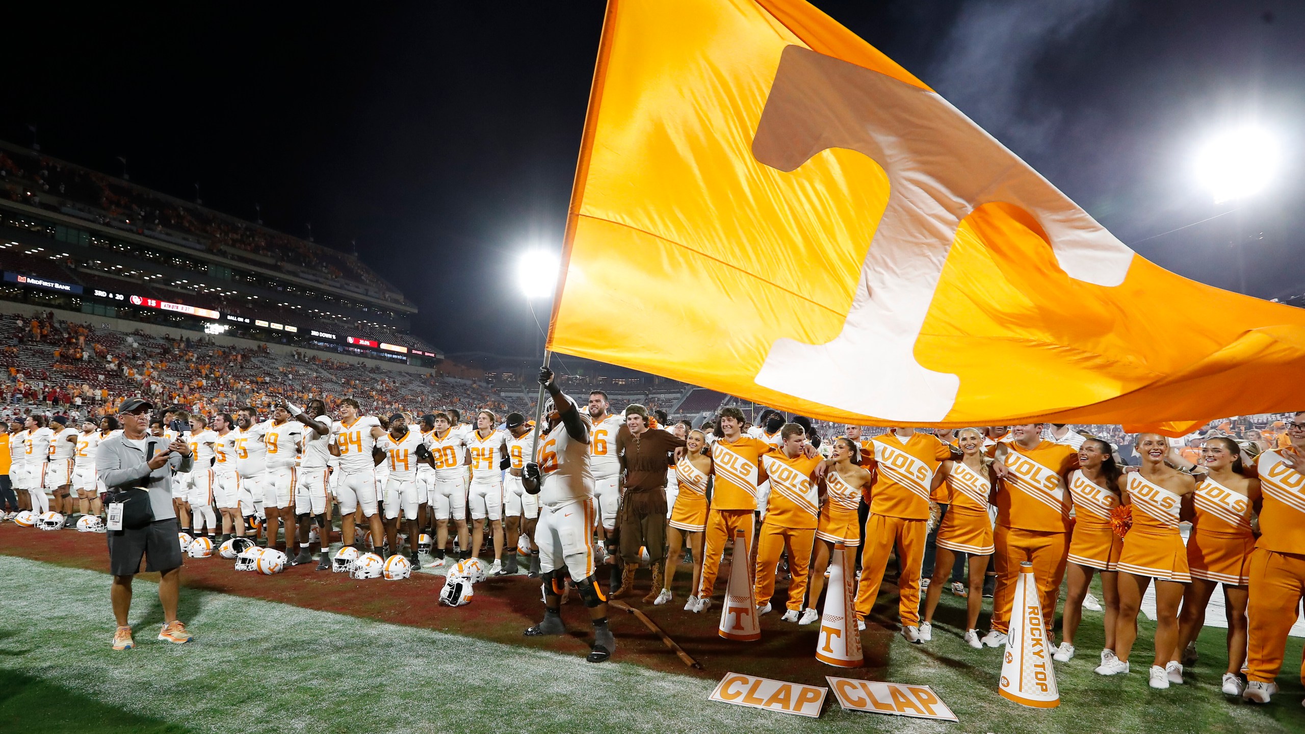 Tennessee offensive lineman Javontez Spraggins (76) waves a giant Tennessee flag after his team defeated Oklahoma in an NCAA college football game Saturday, Sept. 21, 2024, in Norman, Okla. (AP Photo/Alonzo Adams)