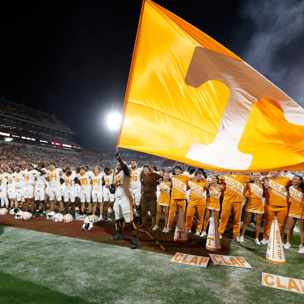 Tennessee offensive lineman Javontez Spraggins (76) waves a giant Tennessee flag after his team defeated Oklahoma in an NCAA college football game Saturday, Sept. 21, 2024, in Norman, Okla. (AP Photo/Alonzo Adams)