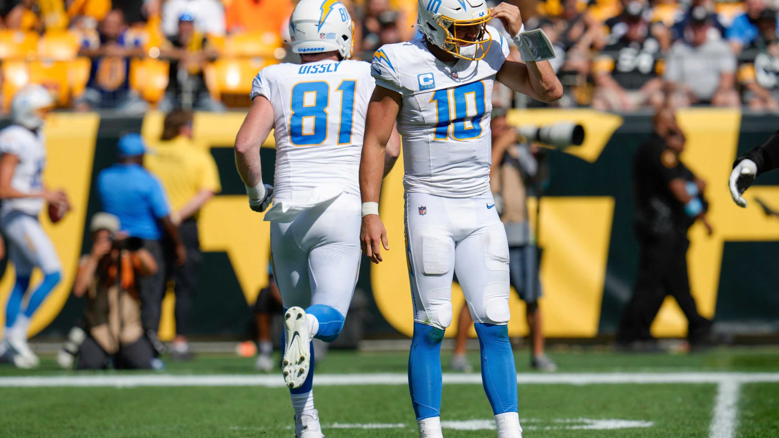 Los Angeles Chargers quarterback Justin Herbert (10) walks off the field after being sacked by Pittsburgh Steelers linebacker Elandon Roberts during the second half of an NFL football game, Sunday, Sept. 22, 2024, in Pittsburgh. (AP Photo/Gene J. Puskar)