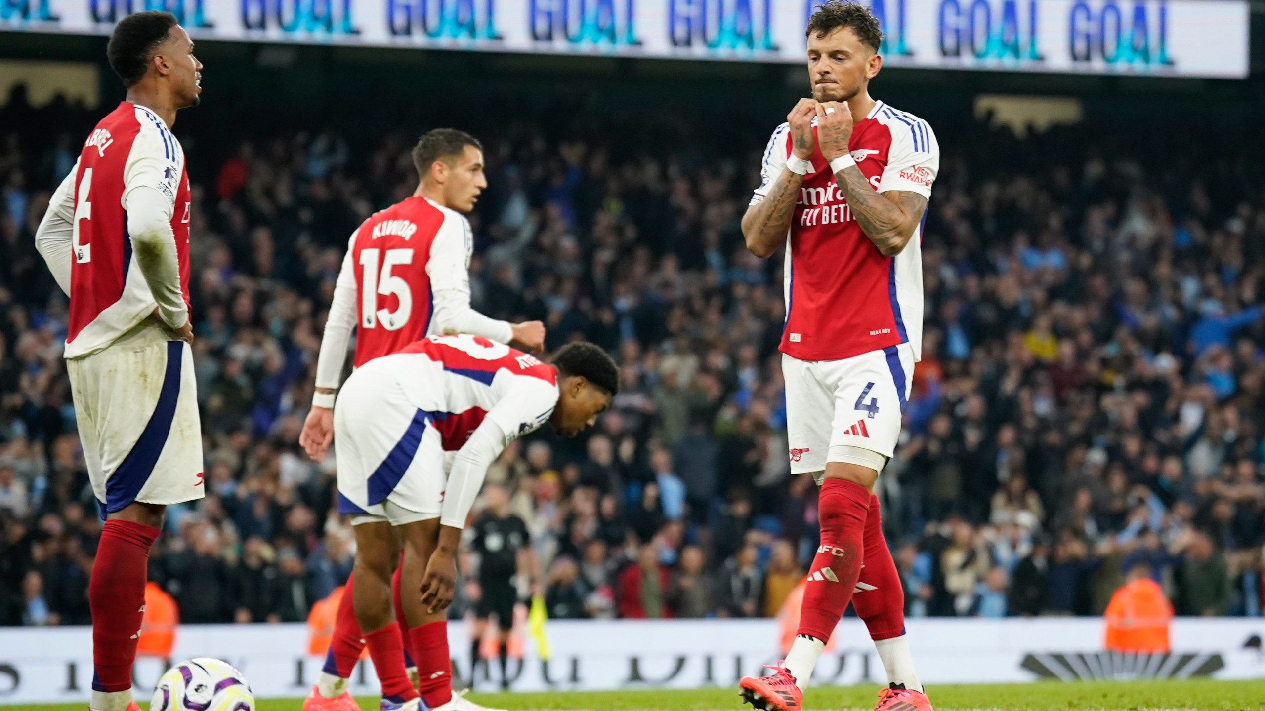 Arsenal players react after Manchester City's John Stones scored an equaliser in the English Premier League soccer match between Manchester City and Arsenal at the Etihad stadium in Manchester, England, Sunday, Sept. 22, 2024. (AP Photo/Dave Thompson)