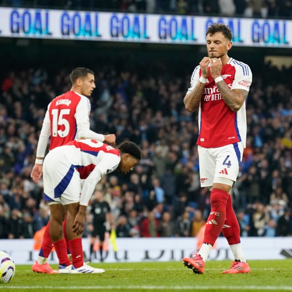 Arsenal players react after Manchester City's John Stones scored an equaliser in the English Premier League soccer match between Manchester City and Arsenal at the Etihad stadium in Manchester, England, Sunday, Sept. 22, 2024. (AP Photo/Dave Thompson)