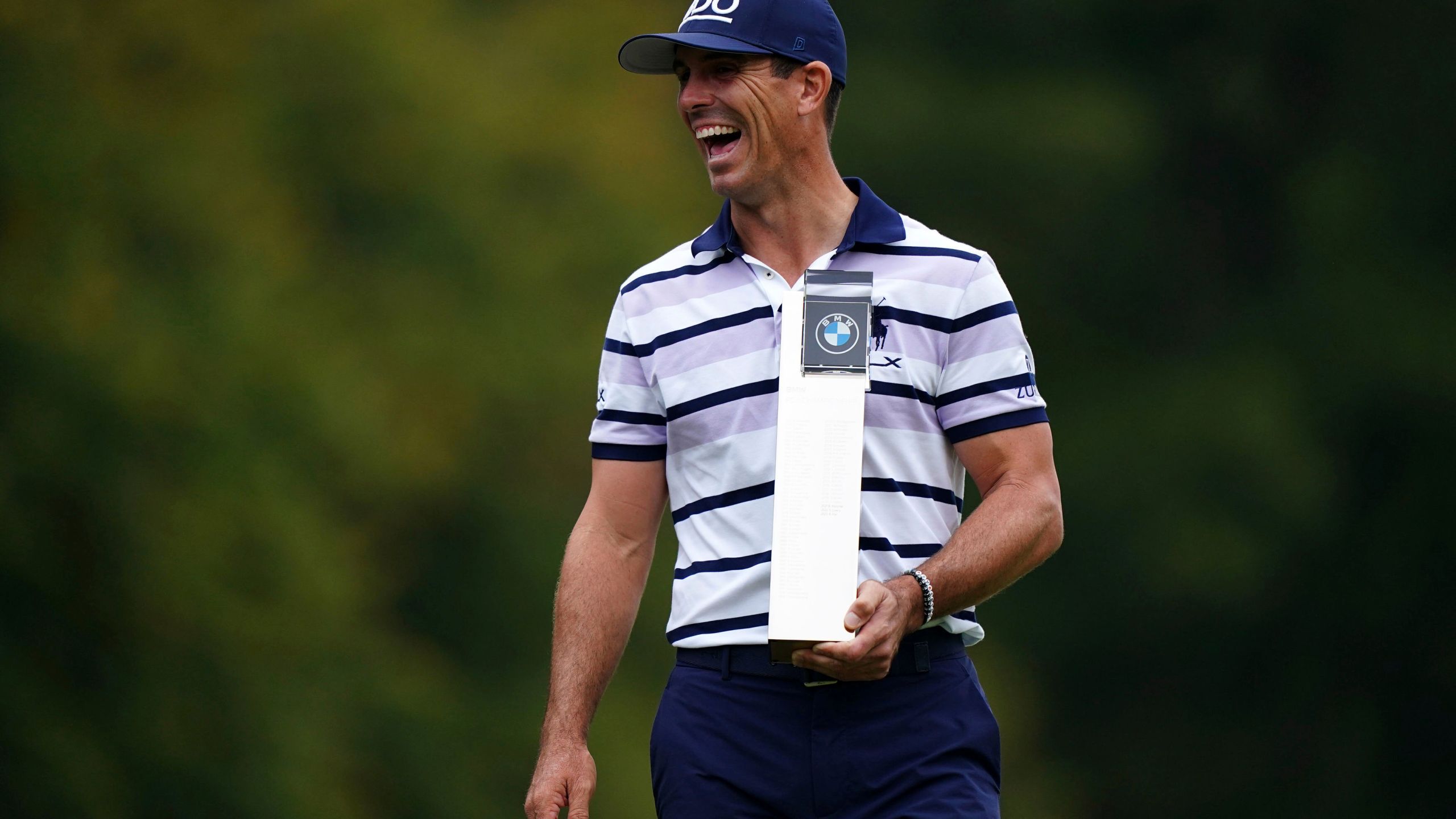 Billy Horschel of the U.S. displays the trophy following day four of the PGA Championship at Wentworth Golf Club in Virginia Water, England, Sunday Sept. 22, 2024. (Zac Goodwin/PA via AP)