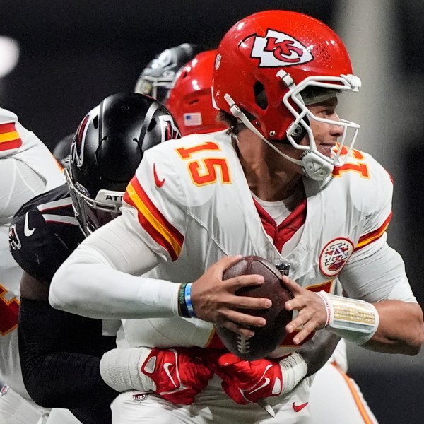 Kansas City Chiefs quarterback Patrick Mahomes (15) is hit by Atlanta Falcons linebacker Arnold Ebiketie (17) during the first half of an NFL football game, Sunday, Sept. 22, 2024, in Atlanta. (AP Photo/Brynn Anderson)