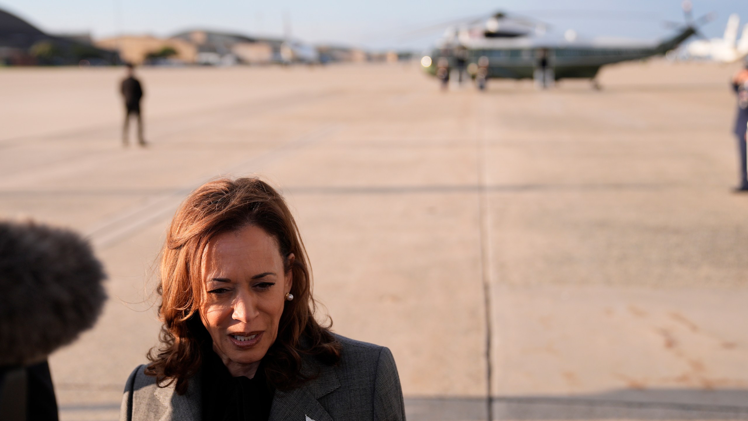 Democratic presidential nominee Vice President Kamala Harris speaks to members of the media upon her arrival at Andrews Air Force Base, Md., Sunday, Sept. 22, 2024. (AP Photo/Matt Rourke/Pool)