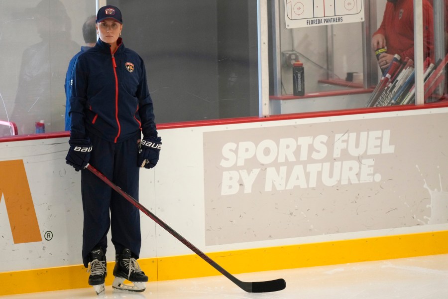 Christine Bumstead, a performance coach for the Saskatoon Blades in Canada's Western Hockey League, watches as Florida Panthers players do drills during NHL hockey training camp, Thursday, Sept. 19, 2024, in Fort Lauderdale, Fla. Bumstead is working as part of the Panthers coaching staff during training camp. (AP Photo/Lynne Sladky)