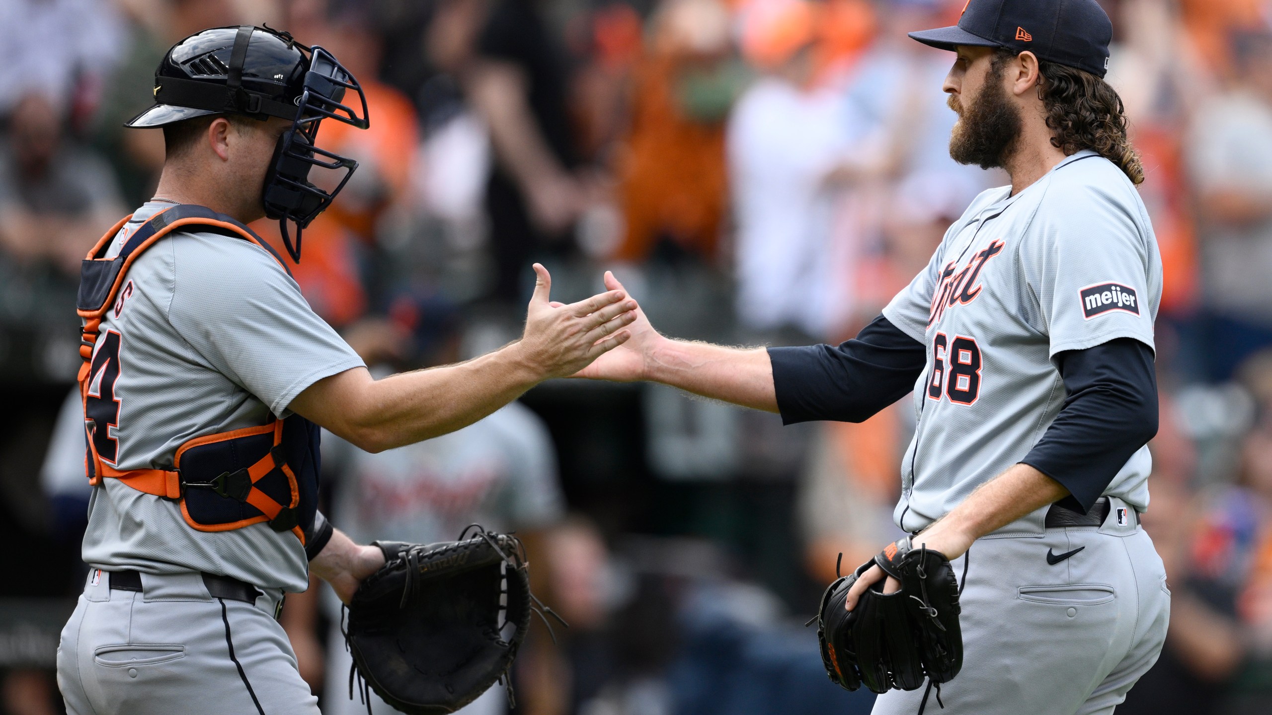 Detroit Tigers relief pitcher Jason Foley (68) and catcher Jake Rogers, left, celebrate after a baseball game against the Baltimore Orioles, Sunday, Sept. 22, 2024, in Baltimore. The Tigers won 4-3. (AP Photo/Nick Wass)