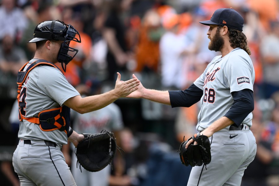 Detroit Tigers relief pitcher Jason Foley (68) and catcher Jake Rogers, left, celebrate after a baseball game against the Baltimore Orioles, Sunday, Sept. 22, 2024, in Baltimore. The Tigers won 4-3. (AP Photo/Nick Wass)