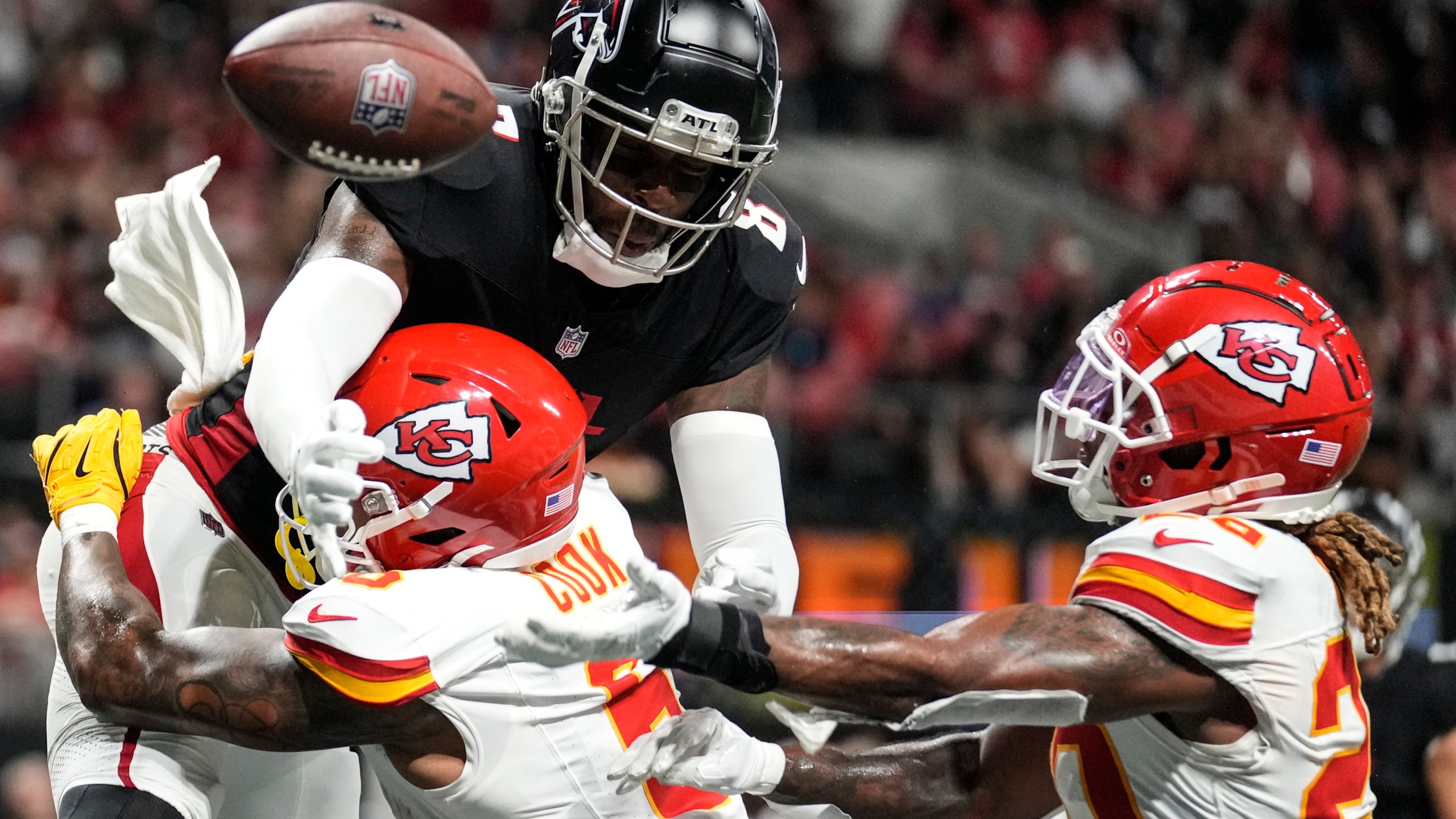 Atlanta Falcons tight end Kyle Pitts (8) misses the catch against Kansas City Chiefs safety Bryan Cook (6) during the second half of an NFL football game, Sunday, Sept. 22, 2024, in Atlanta. (AP Photo/Brynn Anderson)