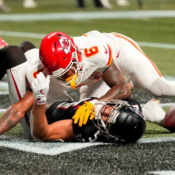 Atlanta Falcons wide receiver Drake London (5) misses the catch in the end zone against Kansas City Chiefs safety Bryan Cook (6) during the second half of an NFL football game, Sunday, Sept. 22, 2024, in Atlanta. (AP Photo/Brynn Anderson)