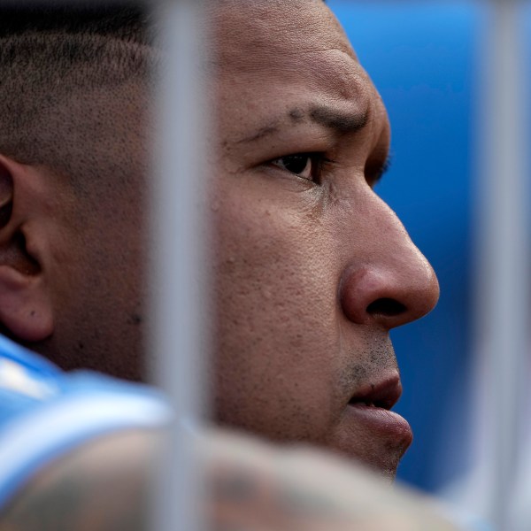 Kansas City Royals' Salvador Perez watches from the dugout during the fourth inning of a baseball game against the San Francisco Giants Saturday, Sept. 21, 2024, in Kansas City, Mo. (AP Photo/Charlie Riedel)