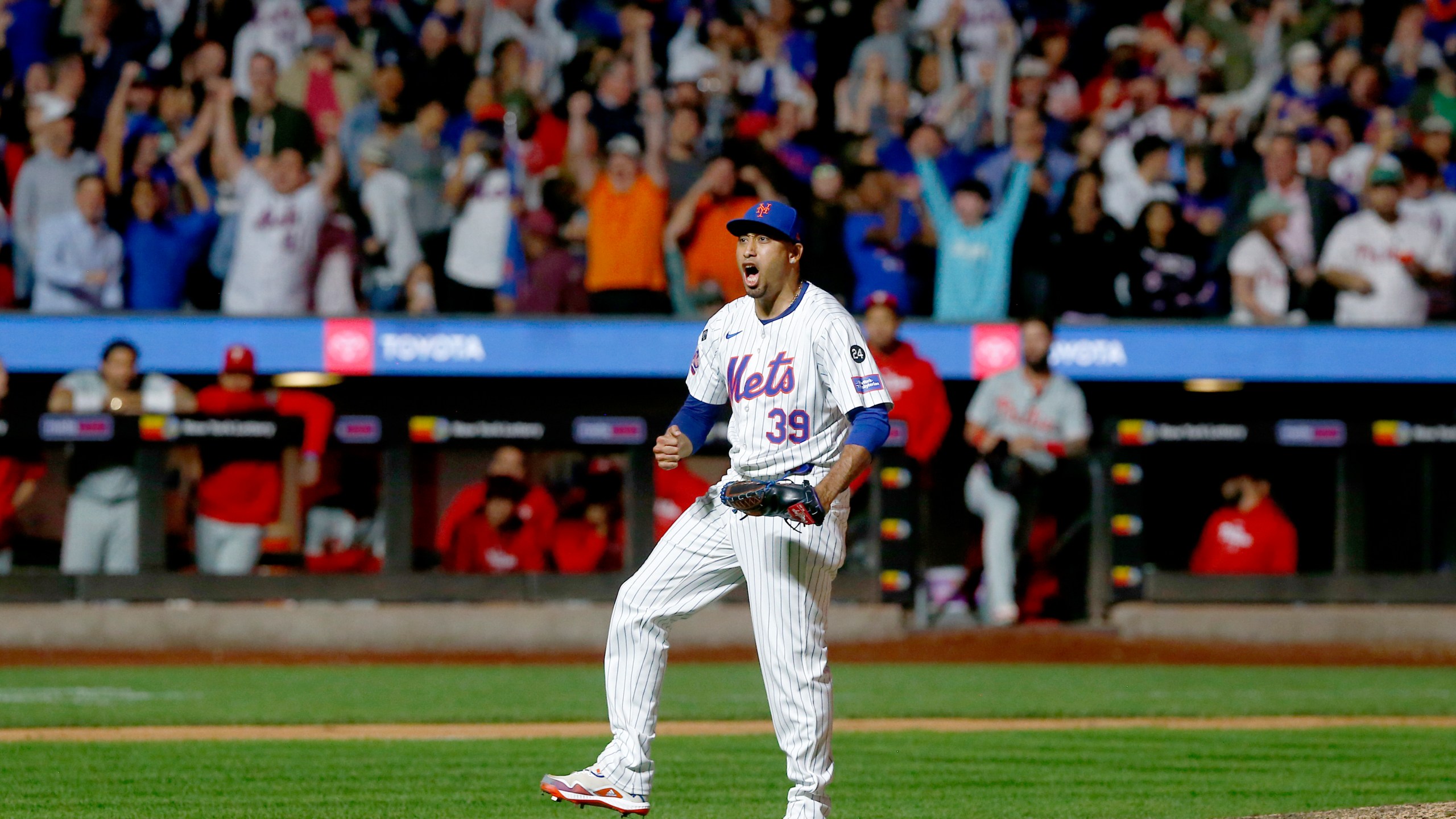 New York Mets relief pitcher Edwin Diaz reacts after striking out Kody Clemens for the final out during a baseball game against the Philadelphia Phillies, Sunday, Sept. 22, 2024, in New York. (AP Photo/John Munson)