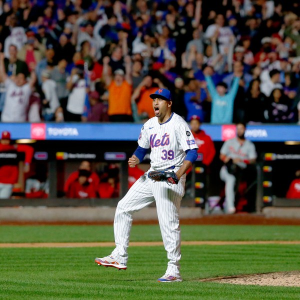 New York Mets relief pitcher Edwin Diaz reacts after striking out Kody Clemens for the final out during a baseball game against the Philadelphia Phillies, Sunday, Sept. 22, 2024, in New York. (AP Photo/John Munson)