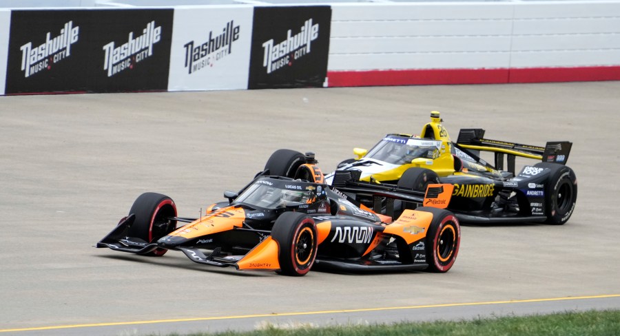 Pato O'Ward (5) and Colton Herta (26) drive during an IndyCar auto race Sunday, Sept. 15, 2024, at Nashville Superspeedway in Lebanon, Tenn. (AP Photo/Mark Humphrey)