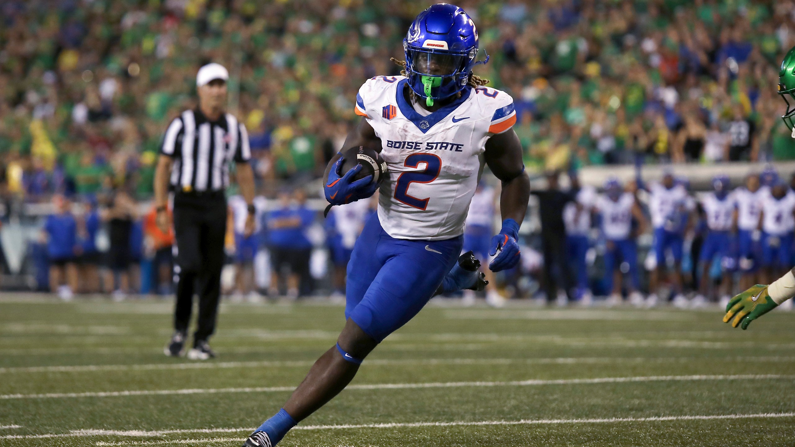 Boise State running back Ashton Jeanty (2) runs the ball during the first half of an NCAA college football game against Oregon, Saturday, Sept. 7, 2024, at Autzen Stadium in Eugene, Ore. (AP Photo/Lydia Ely)