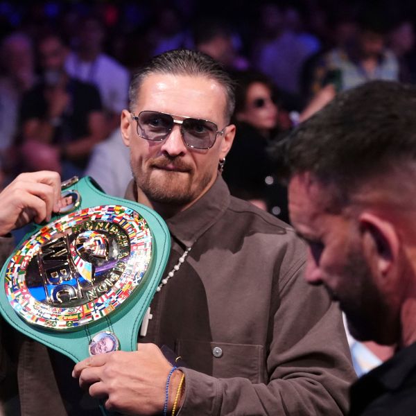 Ukrainian boxer Oleksandr Usyk in the stands with his belt at Wembley Stadium, in London, Saturday, Sept. 21, 2024. (Bradley Collyer/PA via AP)