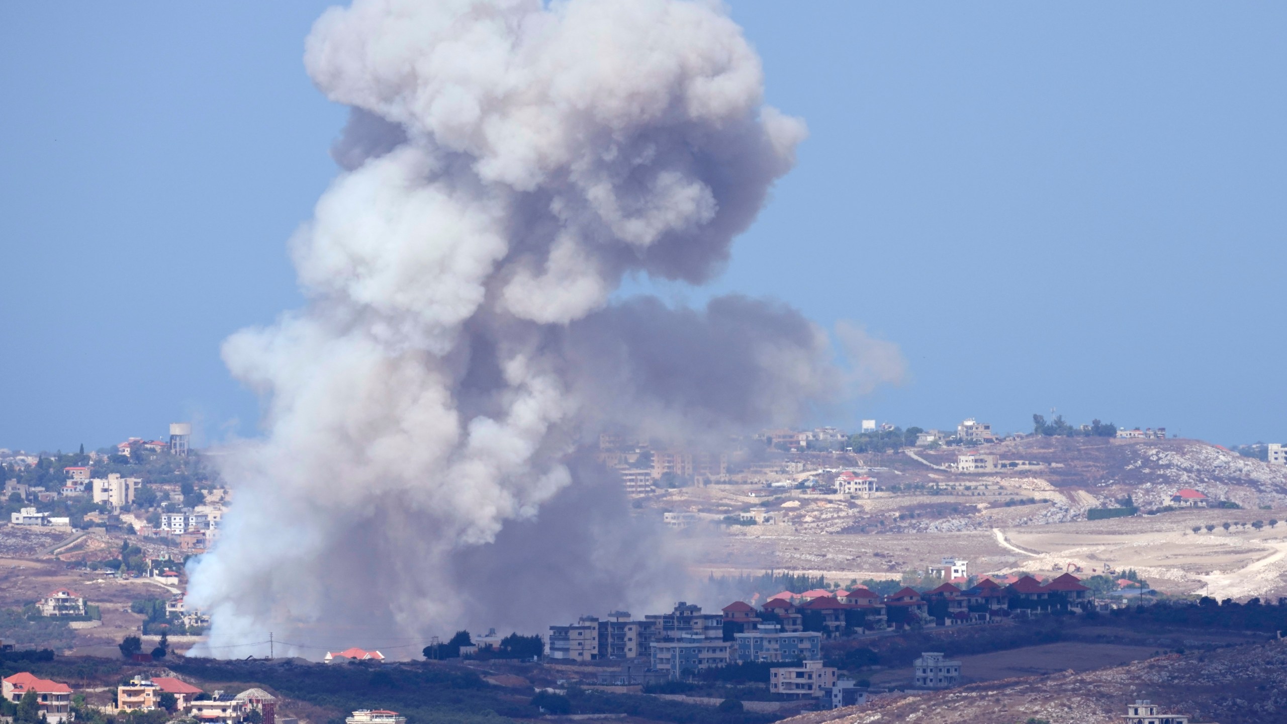 Smoke rises from Israeli airstrikes on villages in the Nabatiyeh district, seen from the southern town of Marjayoun, Lebanon, Monday, Sept. 23, 2024.(AP Photo/Hussein Malla)