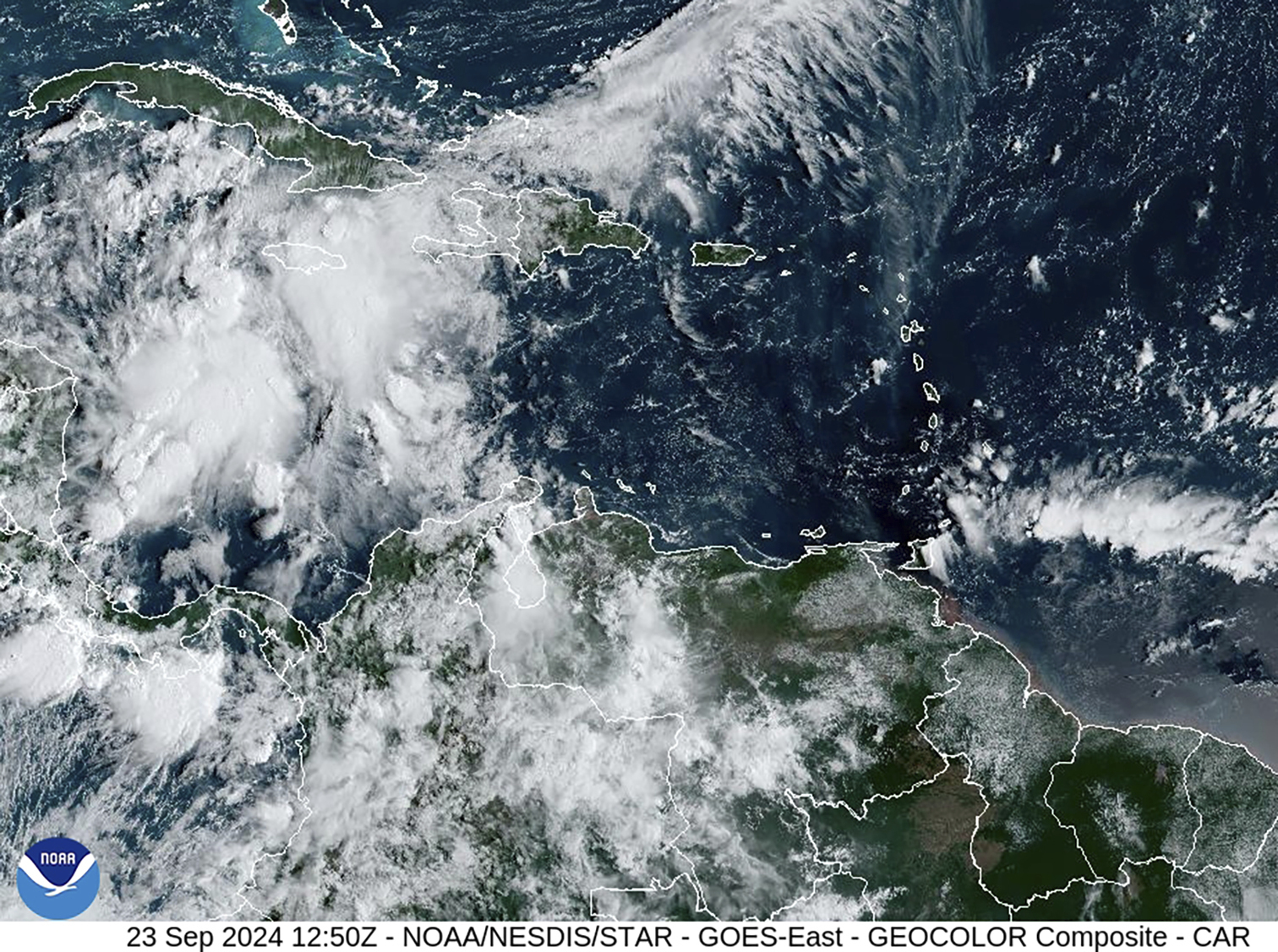 This image provided by the National Oceanic and Atmospheric Administration shows a cluster of storms located south of the Cayman Islands which are expected to strengthen in upcoming days, Monday, Sept. 23, 2024. (NOAA via AP)