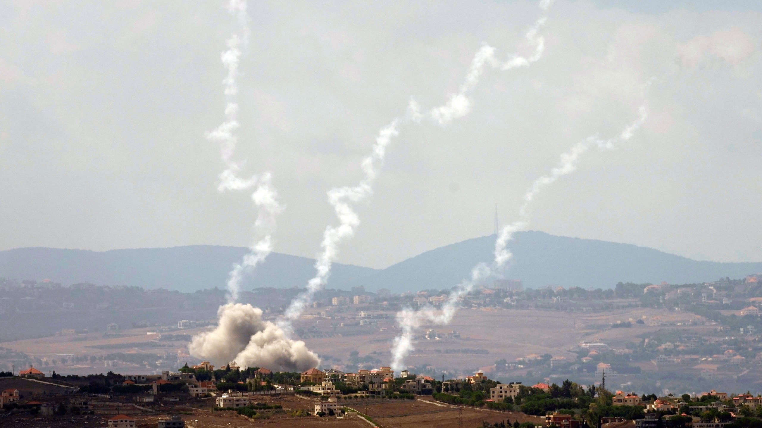 Smoke rises from Israeli airstrikes on Taybeh village, seen from the southern town of Marjayoun, Lebanon, Monday, Sept. 23, 2024. (AP Photo/Hussein Malla)