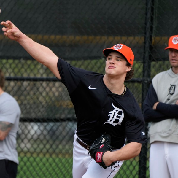 FILE - Detroit Tigers pitcher Jackson Jobe throws during a baseball spring training workout Feb. 16, 2024, in Lakeland, Fla. (AP Photo/Charlie Neibergall, File)