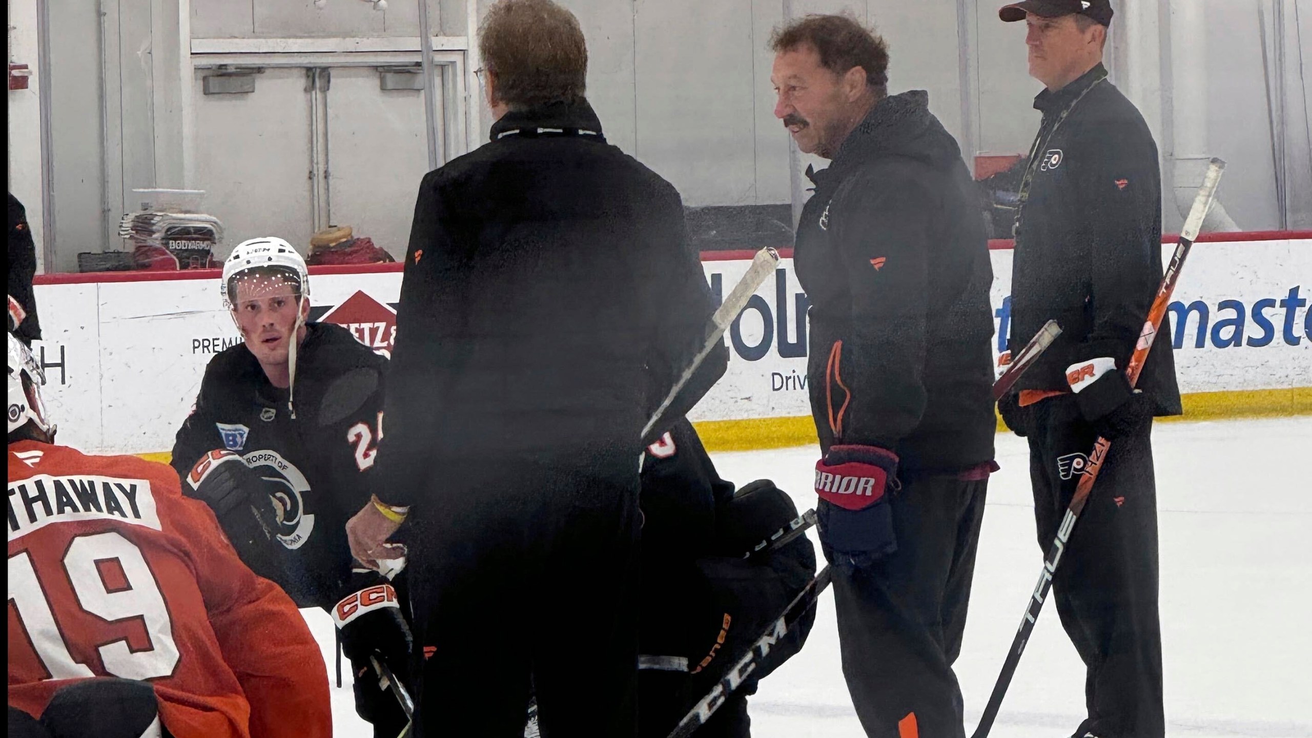 The Philadelphia Flyers host Guy Gaudreau, second from right, the father of Johnny and Matthew Gaudreau, at the team's morning skate, Monday, Sept. 23, 2024, in Voorhees, N.J. (The Philadelphia Inquirer via AP)