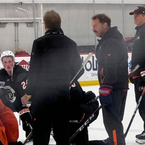 The Philadelphia Flyers host Guy Gaudreau, second from right, the father of Johnny and Matthew Gaudreau, at the team's morning skate, Monday, Sept. 23, 2024, in Voorhees, N.J. (The Philadelphia Inquirer via AP)