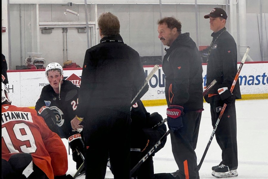 The Philadelphia Flyers host Guy Gaudreau, second from right, the father of Johnny and Matthew Gaudreau, at the team's morning skate, Monday, Sept. 23, 2024, in Voorhees, N.J. (The Philadelphia Inquirer via AP)