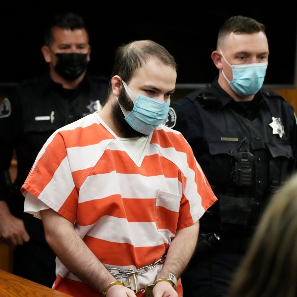 FILE - Ahmad Al Aliwi Alissa, accused of killing 10 people at a Colorado supermarket in March 2021, is led into a courtroom for a hearing, Sept. 7, 2021, in Boulder, Colo. (AP Photo/David Zalubowski, Pool, File)