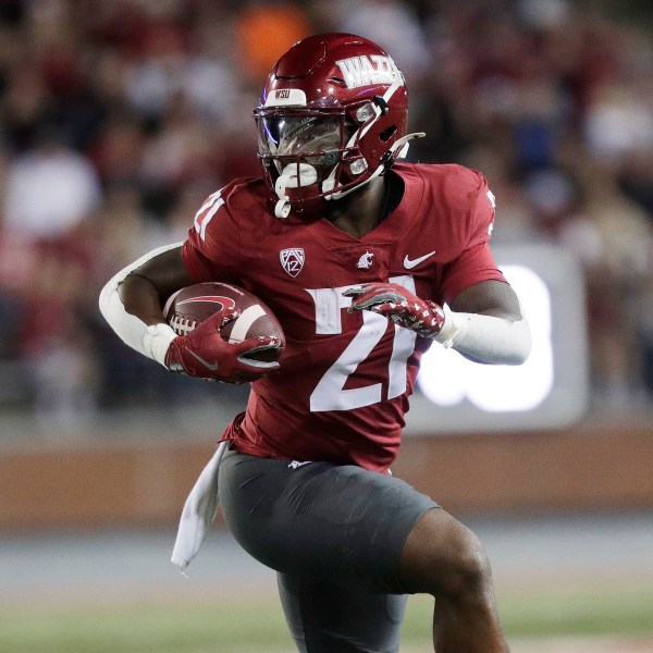 Washington State running back Wayshawn Parker carries the ball during the first half of an NCAA college football game against San Jose State, Friday, Sept. 20, 2024, in Pullman, Wash. (AP Photo/Young Kwak)