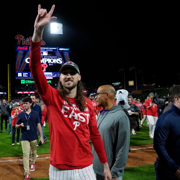 Philadelphia Phillies' Matt Strahm celebrates after winning a baseball game against the Chicago Cubs to clinch the NL East title, Monday, Sept. 23, 2024, in Philadelphia. (AP Photo/Matt Slocum)