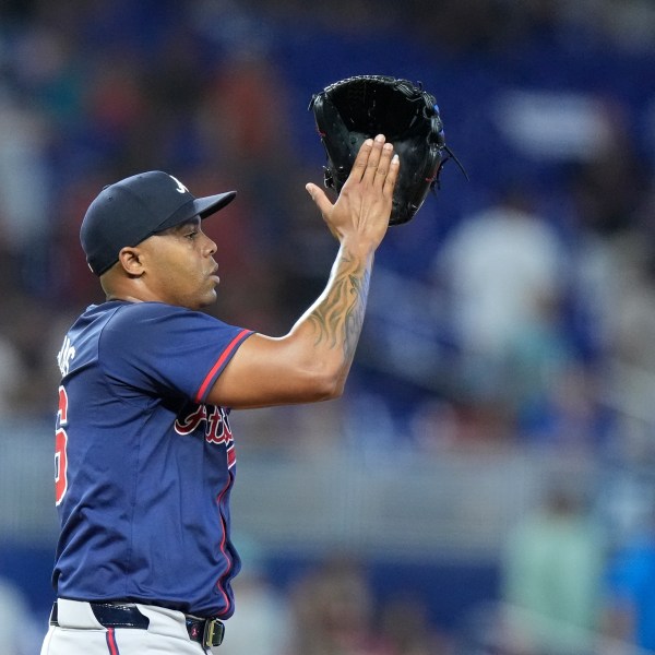 Atlanta Braves relief pitcher Raisel Iglesias celebrates after the Braves beat the Miami Marlins 5-4, during a baseball game, Sunday, Sept. 22, 2024, in Miami. (AP Photo/Wilfredo Lee)