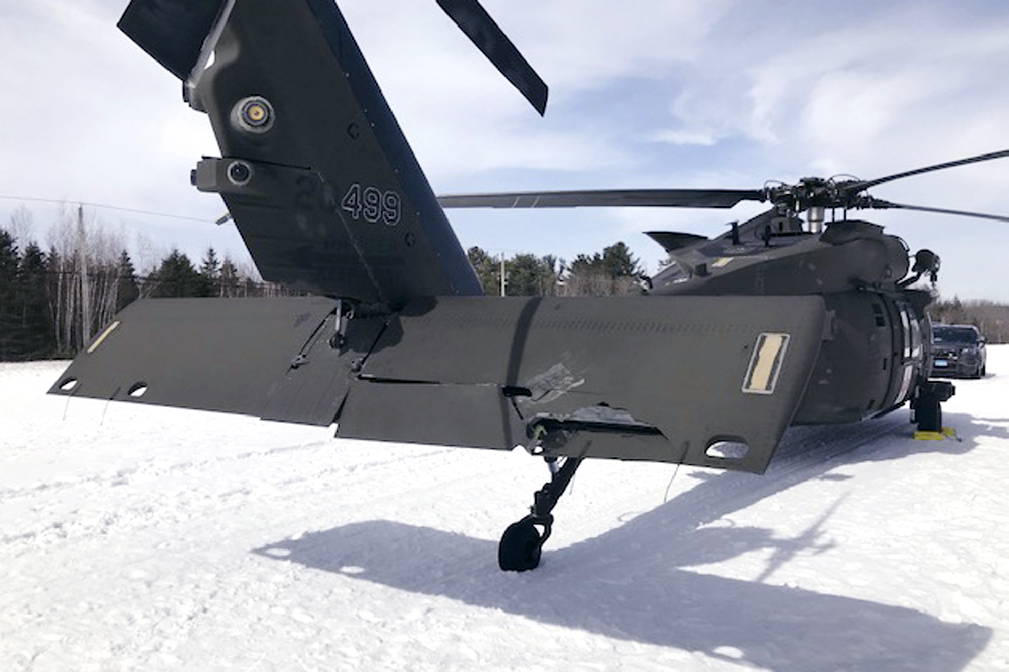 FILE - This U.S. Army photograph by attorney Douglas Desjardins shows a damaged Black Hawk helicopter resting ing the snow, March 13, 2019, in Worthington, Mass. (U.S. Army photograph provided by attorney Douglas Desjardins via AP, File)