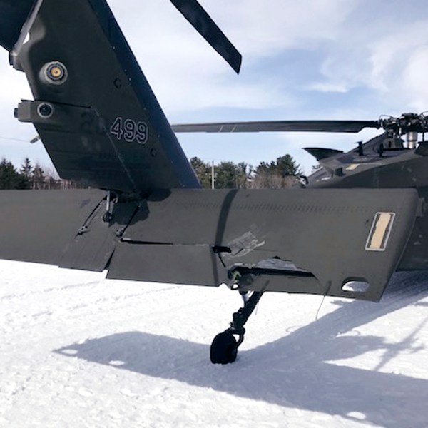 FILE - This U.S. Army photograph by attorney Douglas Desjardins shows a damaged Black Hawk helicopter resting ing the snow, March 13, 2019, in Worthington, Mass. (U.S. Army photograph provided by attorney Douglas Desjardins via AP, File)