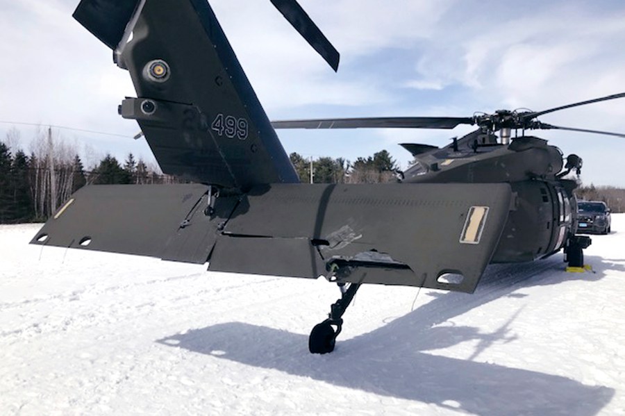 FILE - This U.S. Army photograph by attorney Douglas Desjardins shows a damaged Black Hawk helicopter resting ing the snow, March 13, 2019, in Worthington, Mass. (U.S. Army photograph provided by attorney Douglas Desjardins via AP, File)