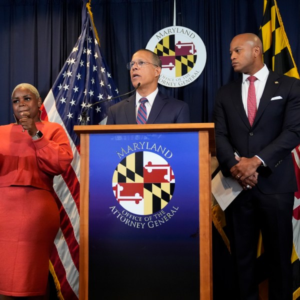 Maryland Attorney General Anthony Brown, center, speaks during a press conference announcing a lawsuit seeking damages from the owners and managers of the Dali cargo ship that crashed into the Francis Key Scott Bridge, Tuesday, Sept. 24, 2024, in Baltimore. (AP Photo/Stephanie Scarbrough)