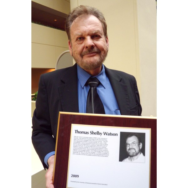 Associated Press Kentucky Broadcast Editor Tom Watson holds his plaque on his induction into the Kentucky Journalism Hall of Fame in Lexington, Ky., April 14, 2009. (AP Photo/Adam Yeomans)