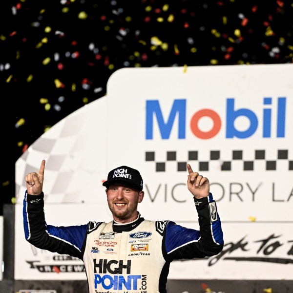 Chase Briscoe celebrates in Victory Lane after winning a NASCAR Cup Series auto race at Darlington Raceway, Sunday, Sept. 1, 2024, in Darlington, S.C. (AP Photo/Matt Kelley)